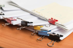 A stack of paperclips on a desk, perfect for bookkeeping.