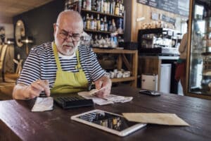 small business owner calculating cash flow status